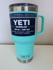 photograph showing the yeti rambler 20oz mug front profile in seafoam color.